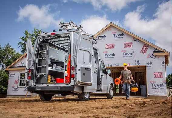 Nissan Commercial Vehicle Van Visualizer interior view: a configurator showing locking shelf doors, ladder keepers, shelving racks, and wire spool holders being placed inside a cargo van, with a running total of $3,663.70 and a Finish and Add to My Build CTA.
